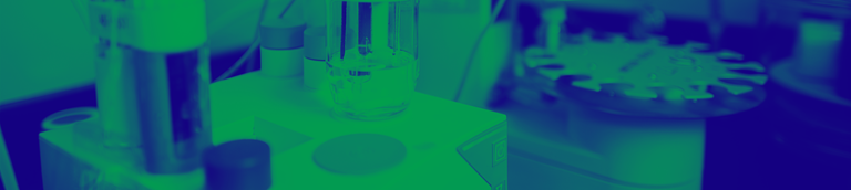 green and blue washed image of vials in a lab