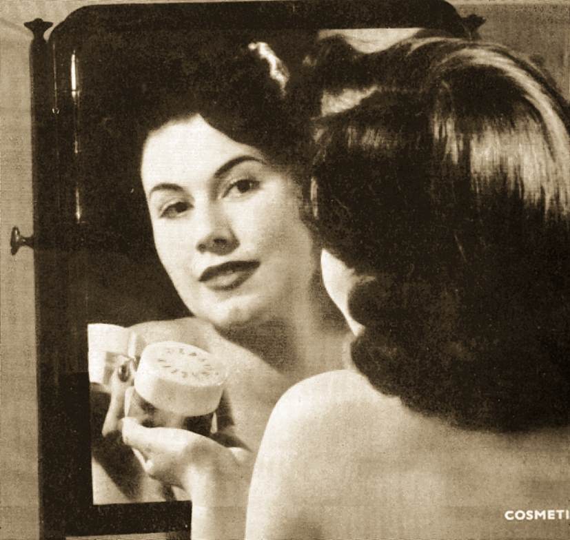 Female applying cosmetic cream containing emulsifying wax