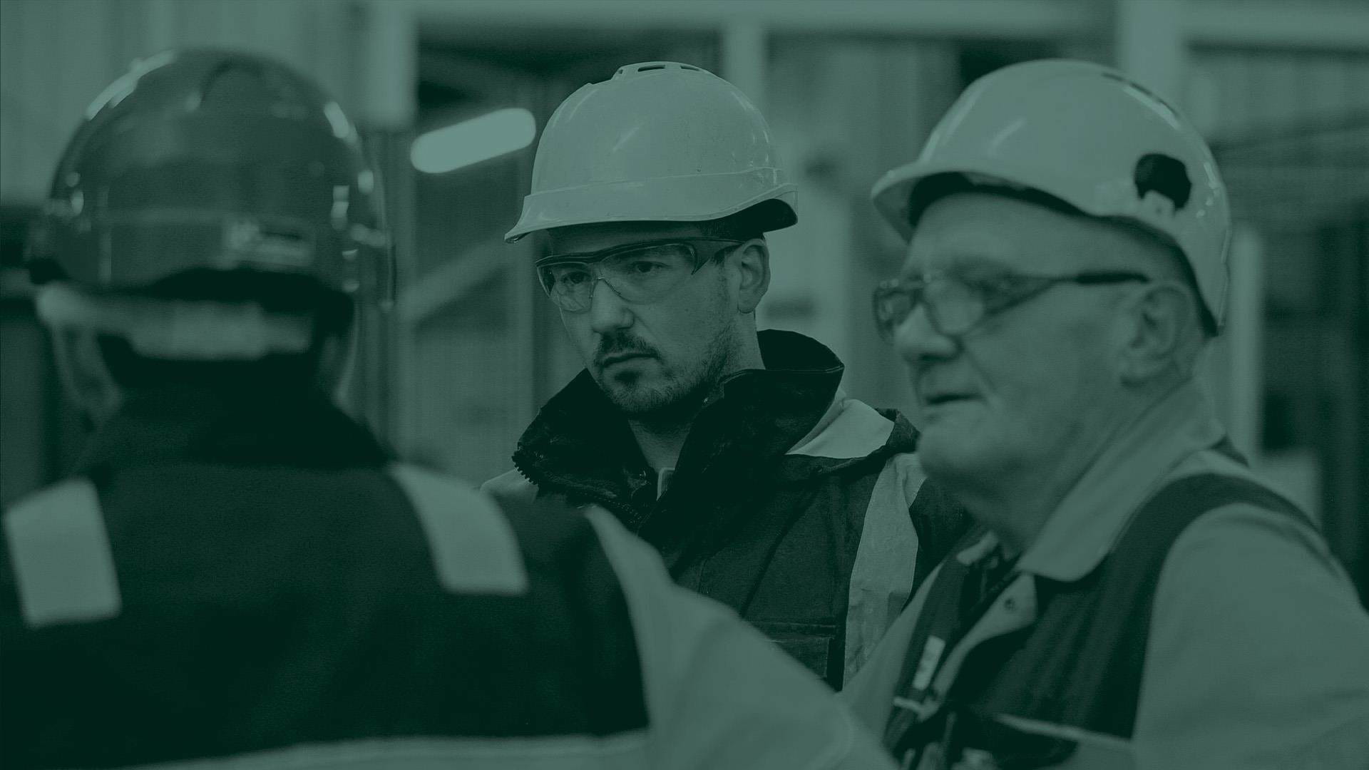 manufacturing employees with a green overlay