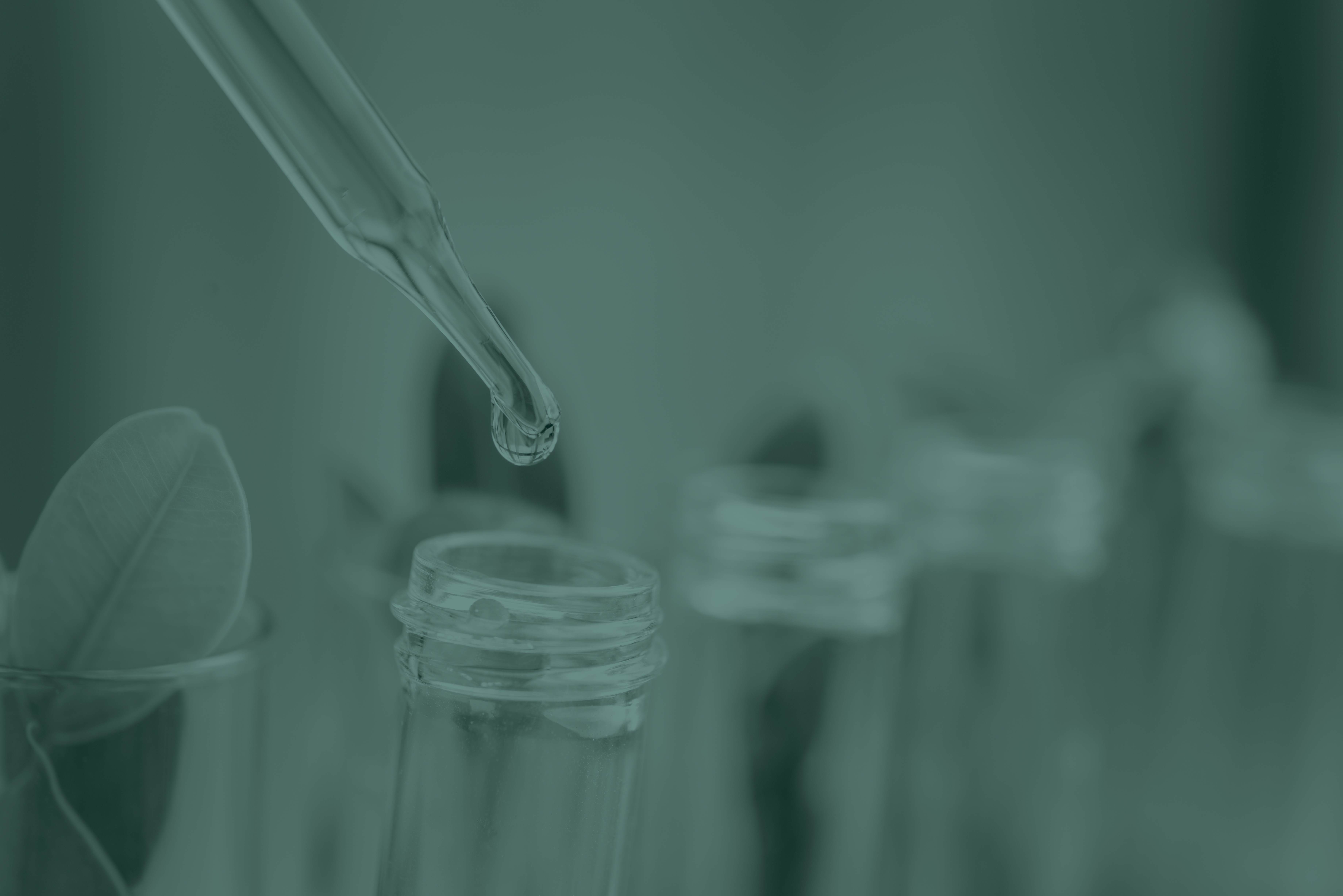 pipet dripping liquid into test tube 