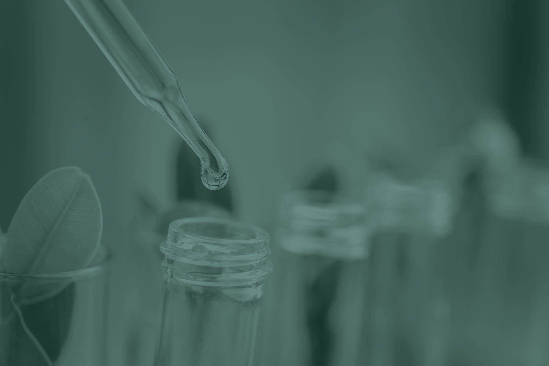 pipet dripping liquid into test tube
