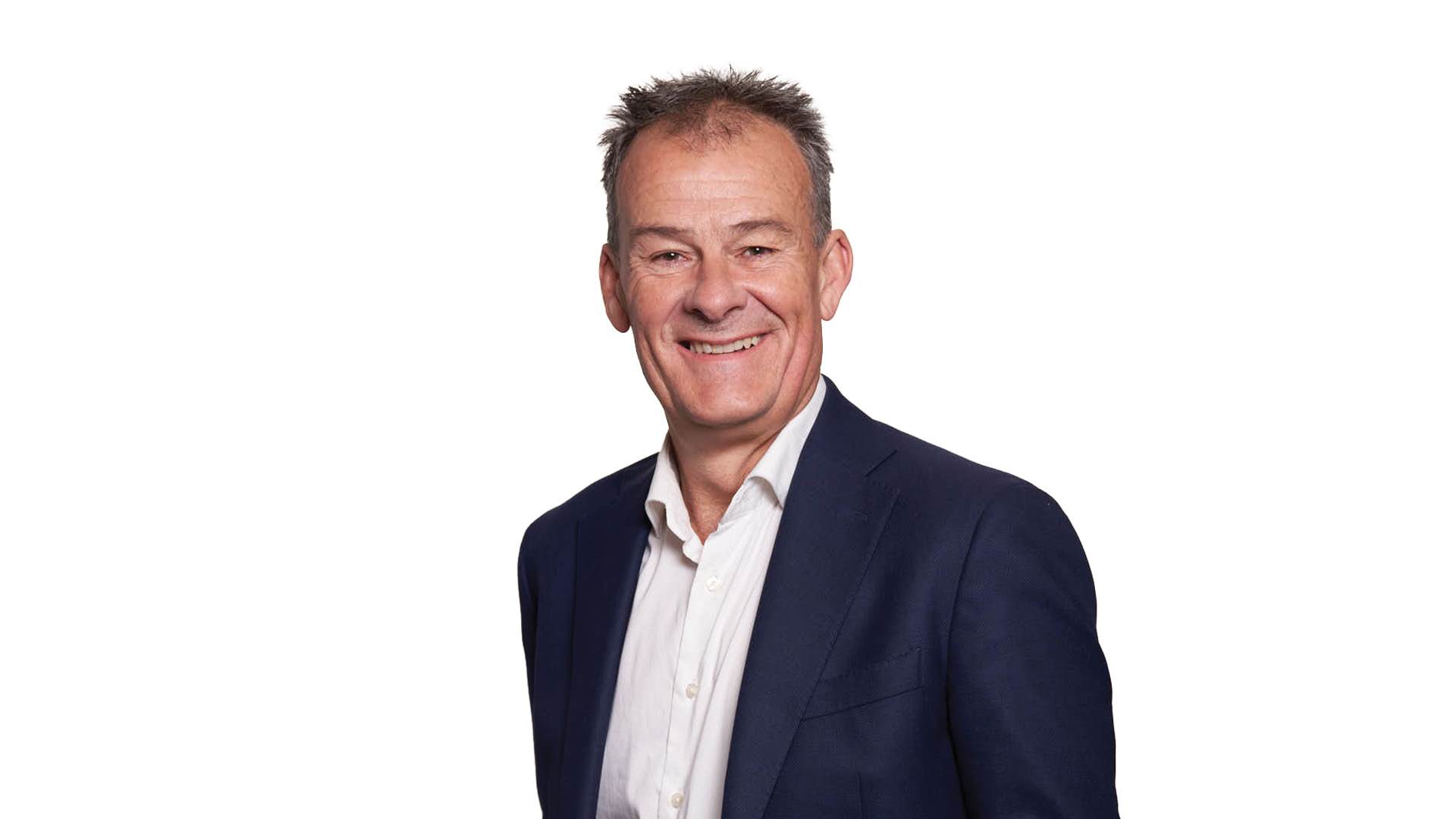 headshot of man wearing suit and tie