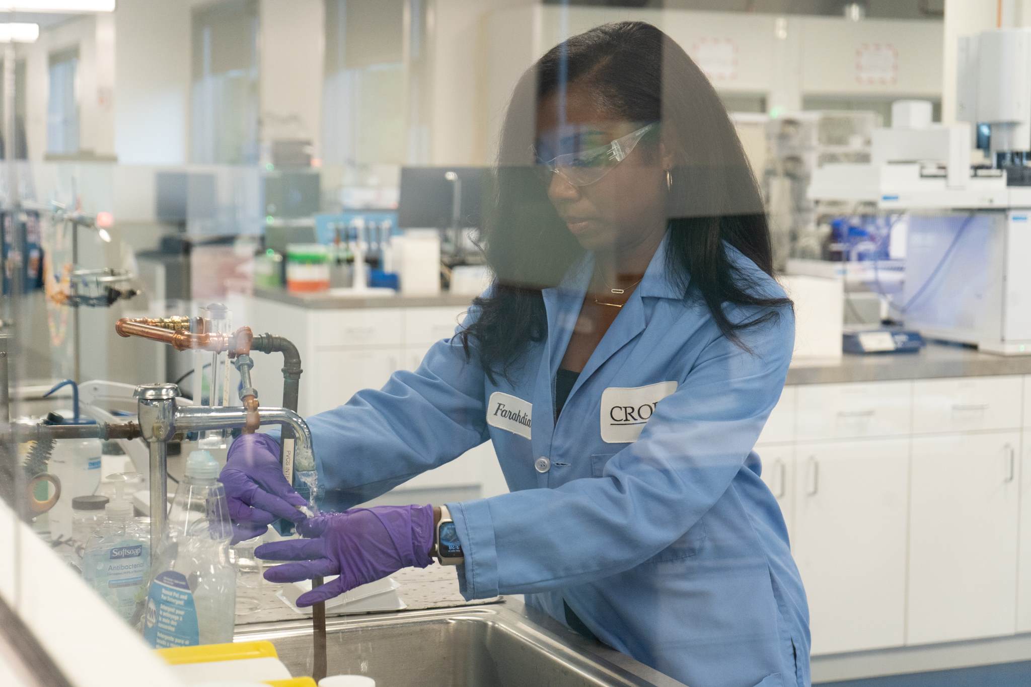 Lady scientist wearing ppe working in a lab