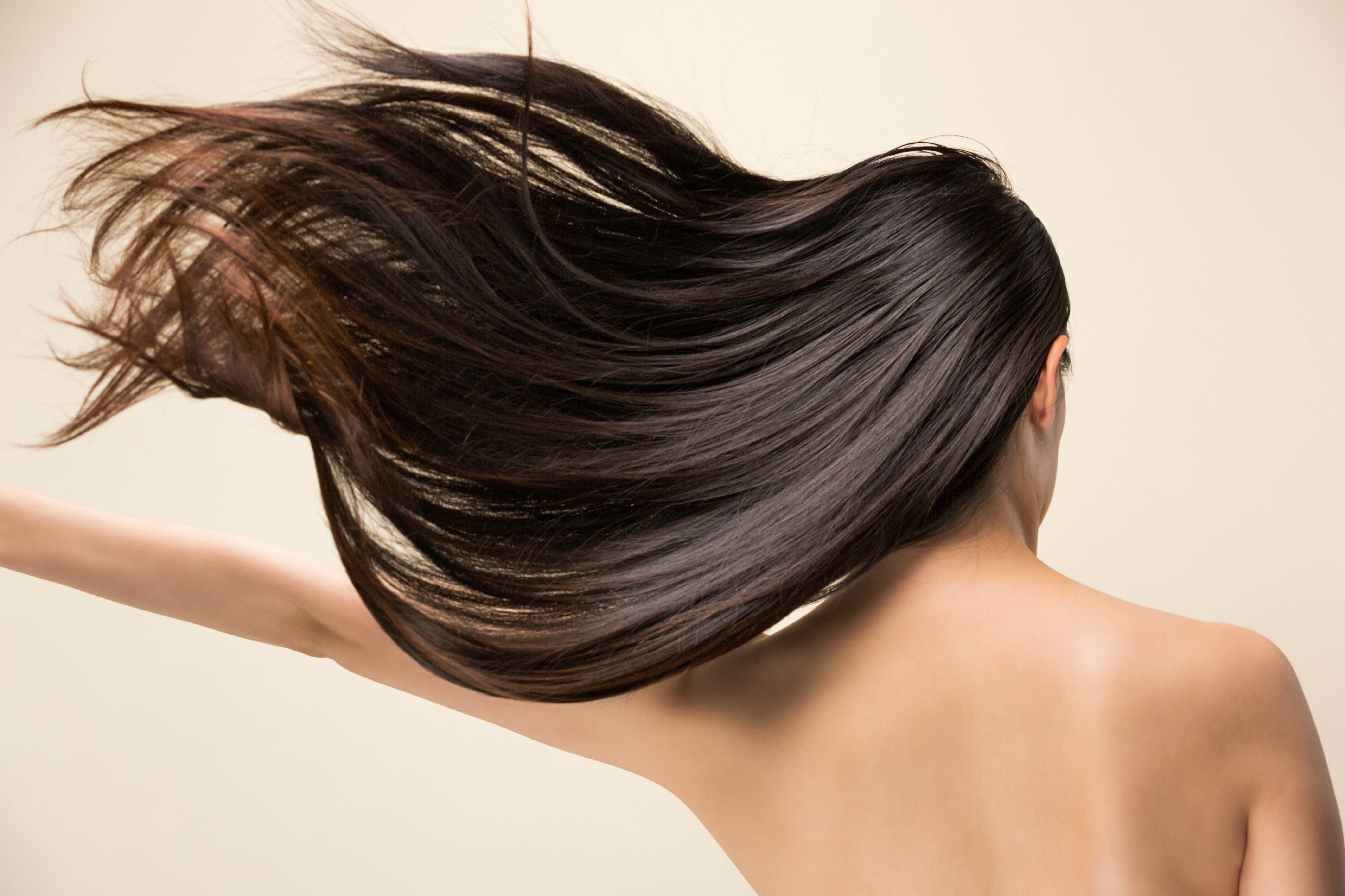 lady with dark flowing hair in the wind