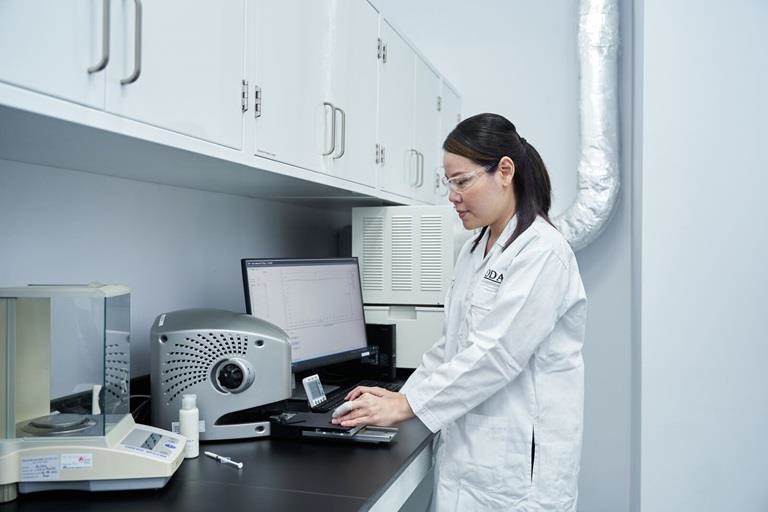 Woman working with croda ingredients in lab