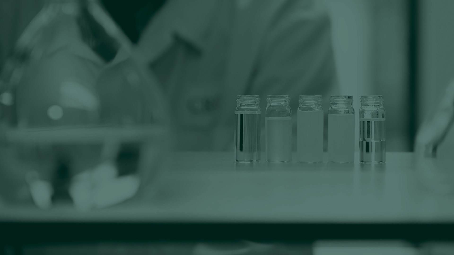 Green tone image of test tubes in a lab