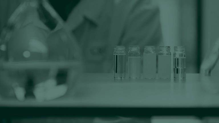 Green tone image of test tubes in a lab