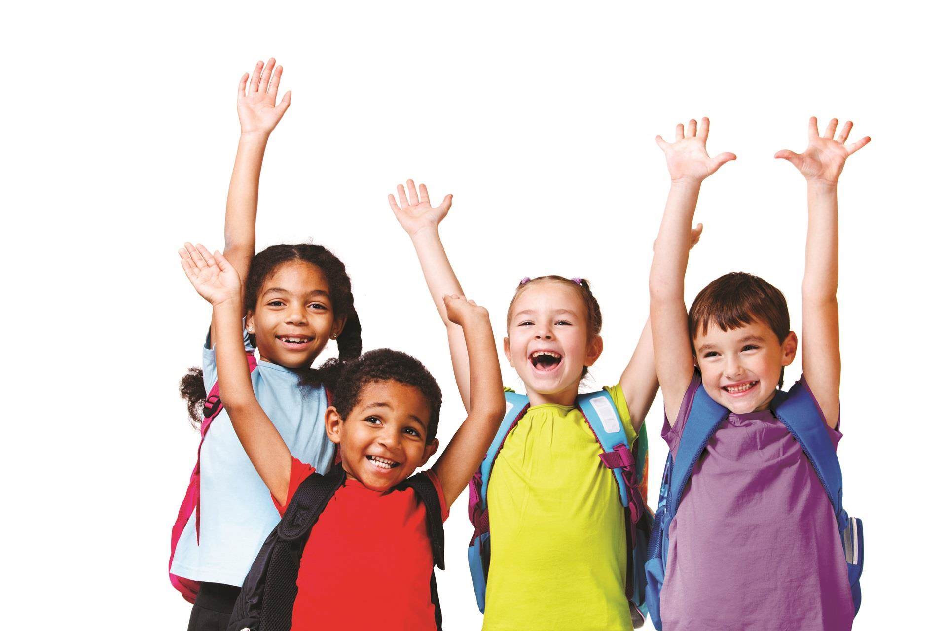 Four happy school kids with their arms raised in the air