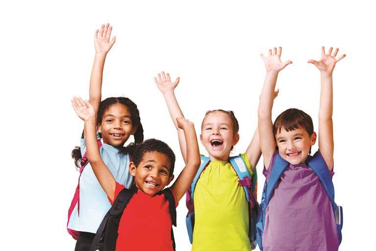 Four happy school kids with their arms raised in the air